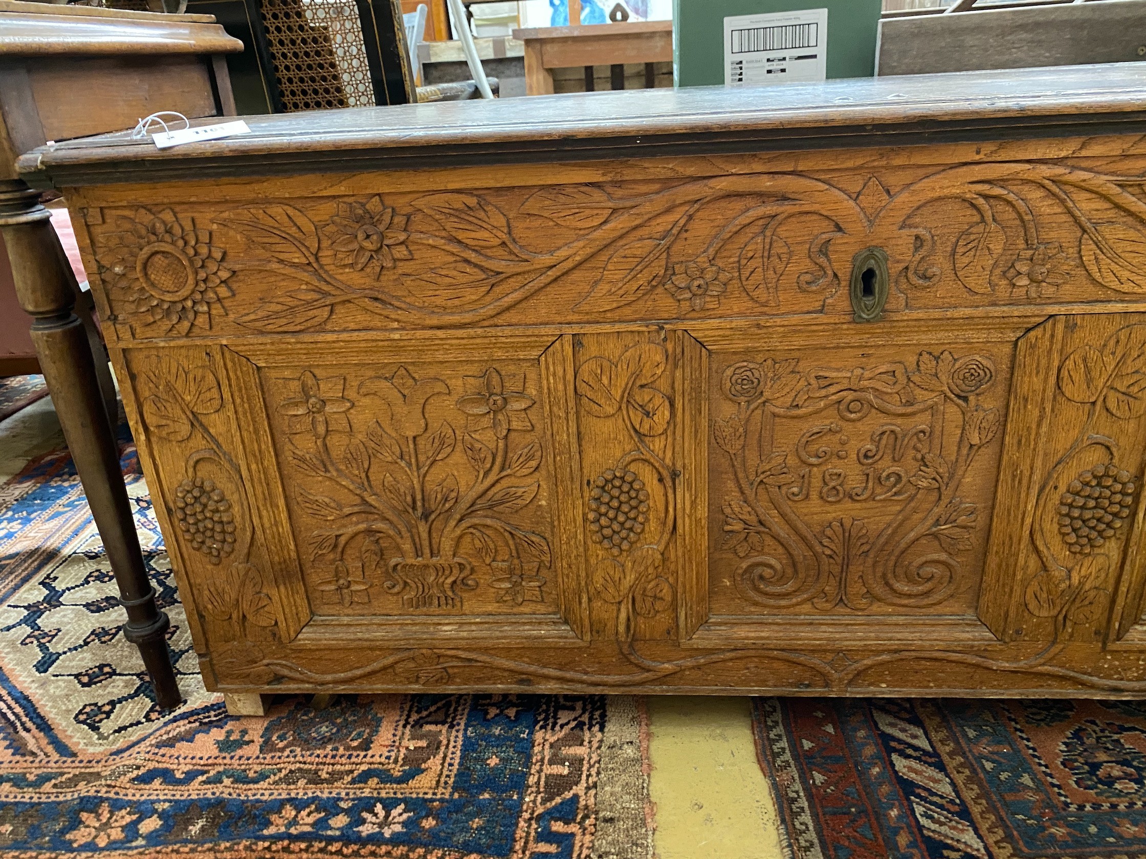 An 18th century and later carved oak coffer, length 134cm, depth 56cm, height 61cm